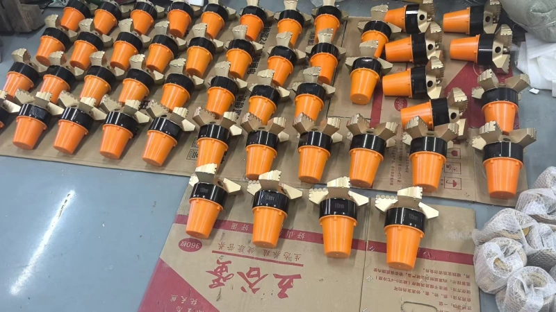 Factory shipment of four-wing concave PDC drill bits for rock drilling grouting and anchoring projects