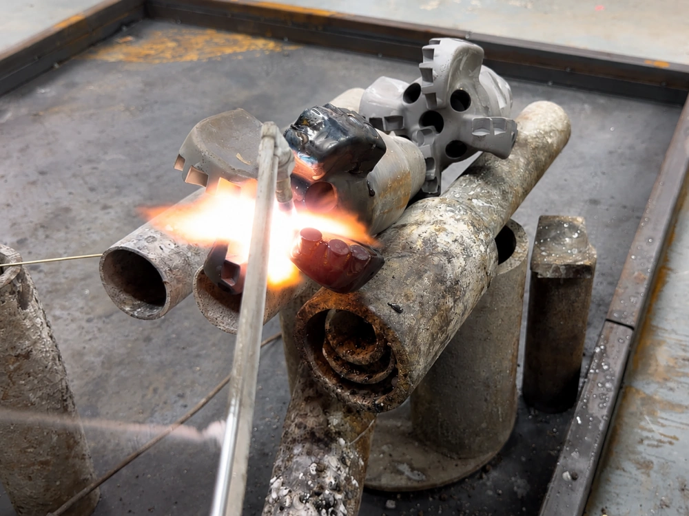 Precision welding and hardfacing process for PDC drill bits - ensuring durability
